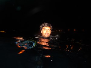 Diver on surface at night