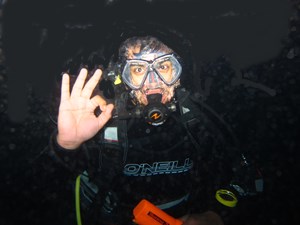 Diver underwater at night
