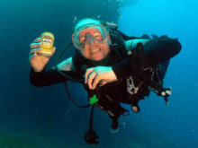 Diver on wreck with beer can
