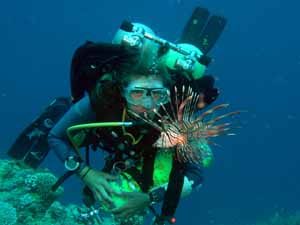 Technical diver with lion fish